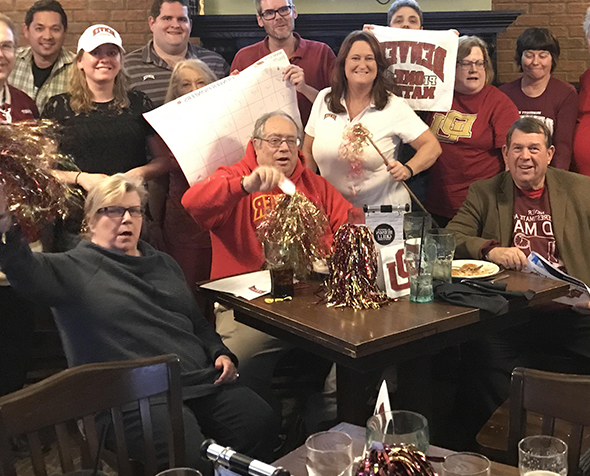 Alums of different ages with DU gear and pom poms